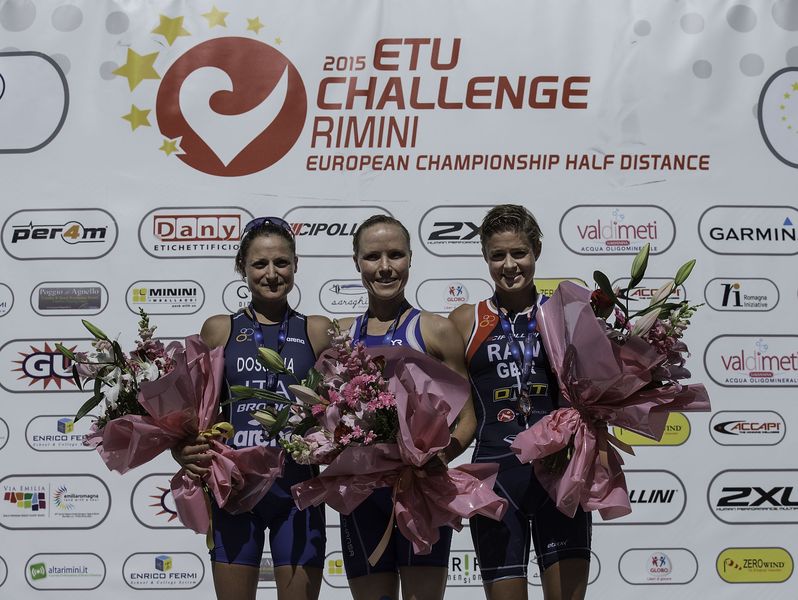 RIMINI, ITALY - MAY 24:  Kaisa Lehtonen (2ndL) from Finland, the first, Sara Dossena (L) from Italy, the second, and Vanessa Raw (R) from Great Britain, the third, pose for a picture at the top three podium during the award ceremony after finishing the 2015 ETU Challenge Rimini European Championship Half Distance on May 24, 2015 in Rimini, Italy.  (Photo by Gonzalo Arroyo Moreno/Getty Images) *** Local Caption *** Kaisa Lehtonen; Sara Dossena; Vanessa Raw