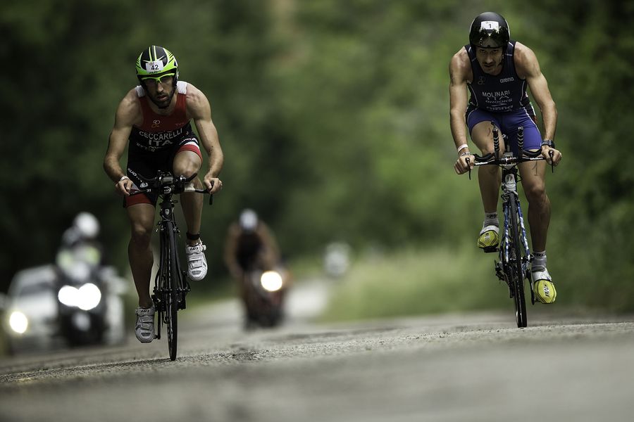 RIMINI, ITALY - MAY 24:  Third place of male category athlete Giulio Molinari (R) from Italy overtakes Mattia Ceccarelli (R) from Italy during the biking course of 2015 ETU Challenge Rimini European Championship Half Distance on May 24, 2015 in Italy.  (Photo by Gonzalo Arroyo Moreno/Getty Images) *** Local Caption *** Giulio Milinari; Mattia Ceccarelli