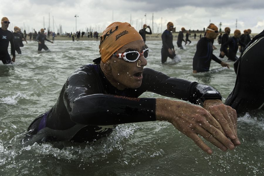 RIMINI, ITALY - MAY 24:  An athlete gets inside the water at the starting point of the swimming course during the 2015 ETU Challenge Rimini European Championship Half Distance on May 24, 2015 in Rimini, Italy.  (Photo by Gonzalo Arroyo Moreno/Getty Images)